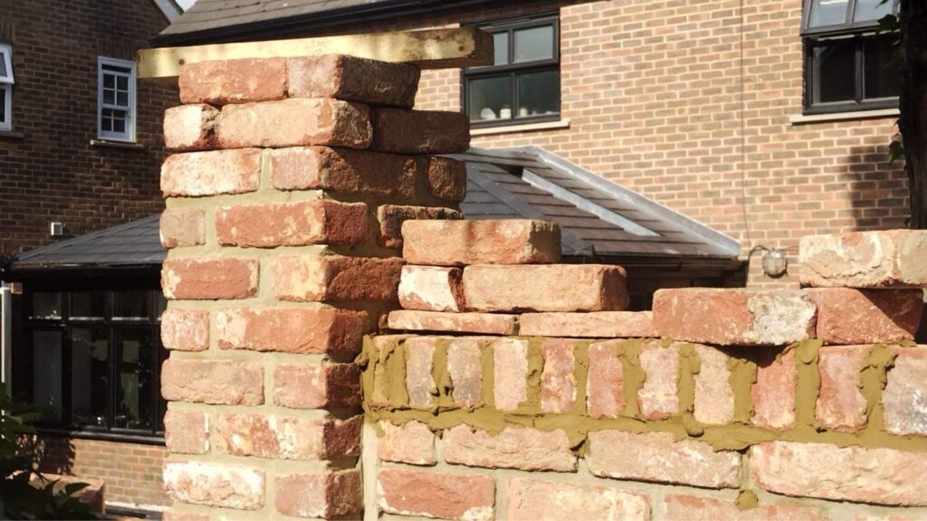 Close-up of partially built brick wall during residential construction