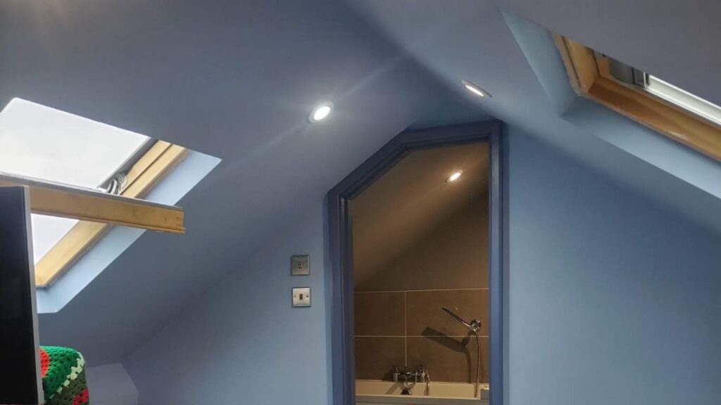 Finished attic room with skylights and access to small bathroom